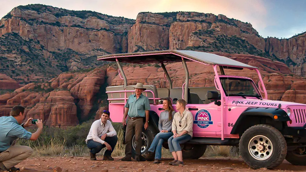 Pink Jeep parked at a red rock overlook on a Sedona jeep tour