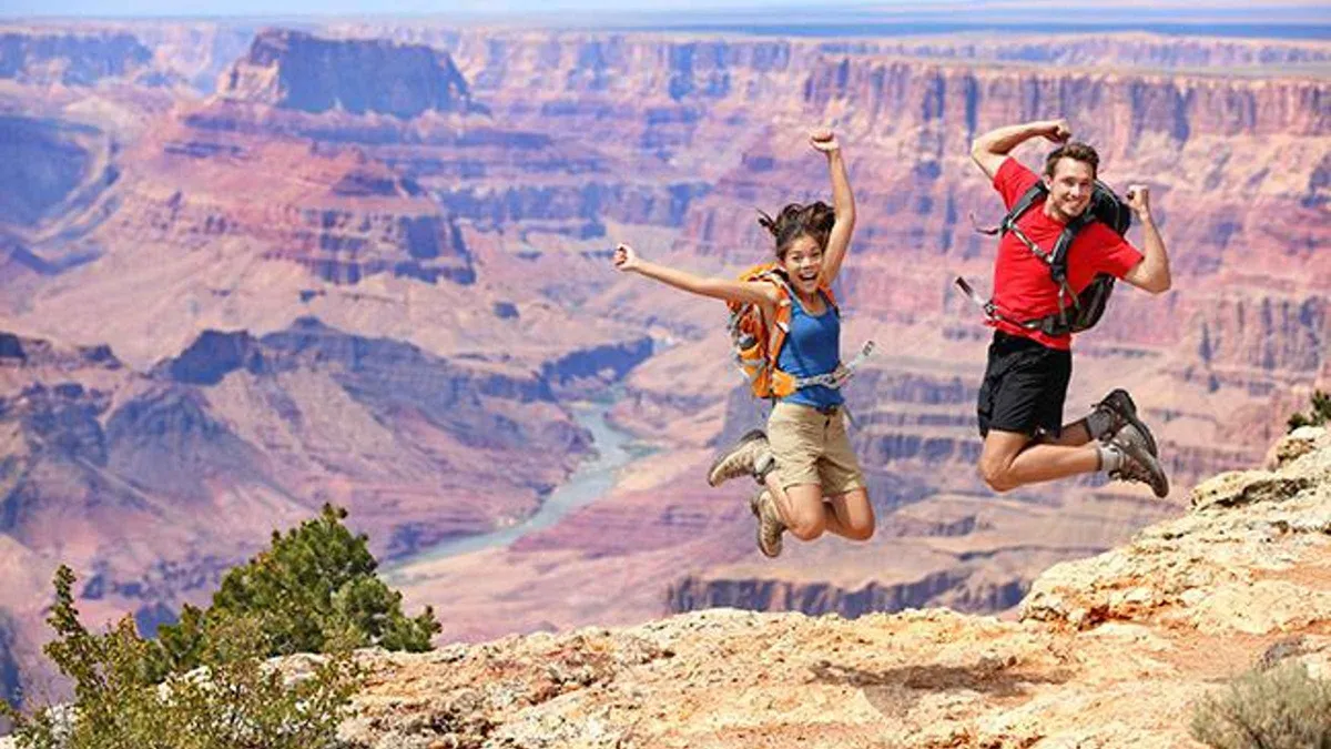 Tour van parked at a Grand Canyon South Rim overlook on a day trip from Sedona
