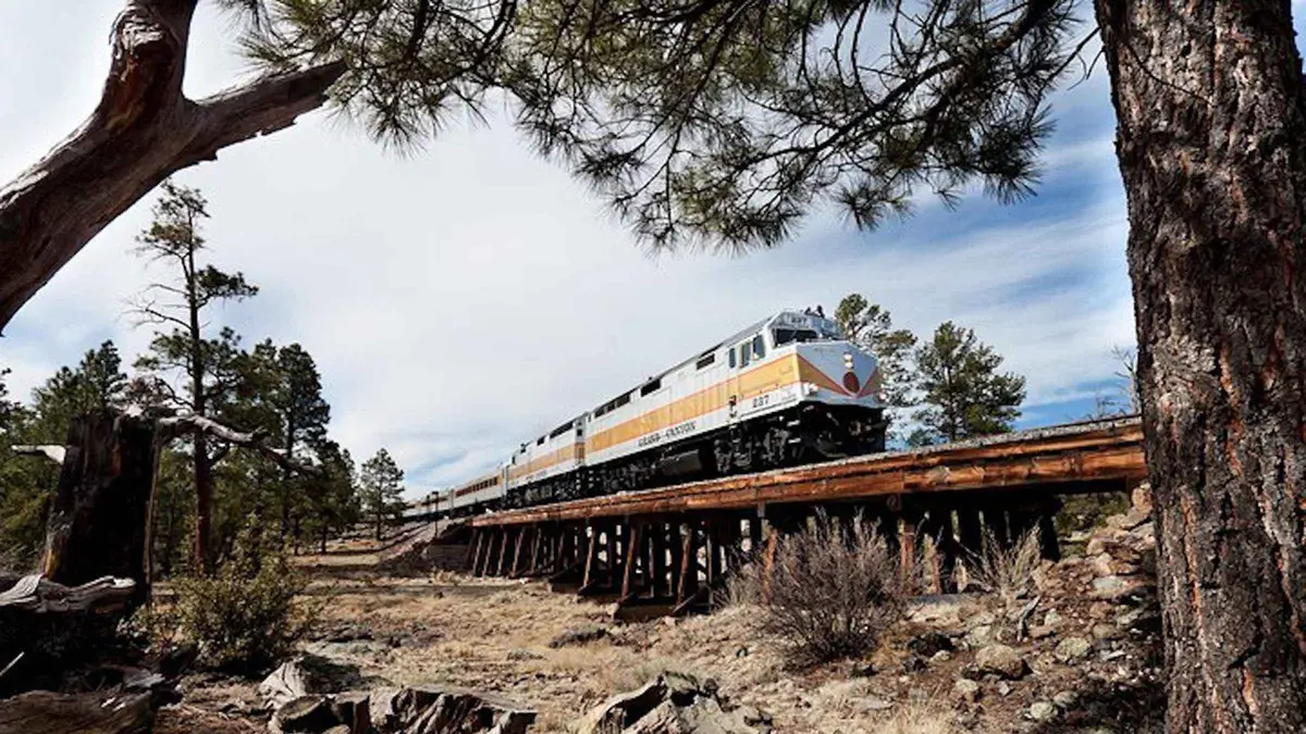 Historic train arriving near the Grand Canyon on a Sedona day tour