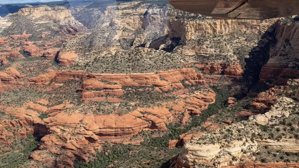 Cessna airplane wing over Sycamore Canyon on a Verde Valley scenic flight